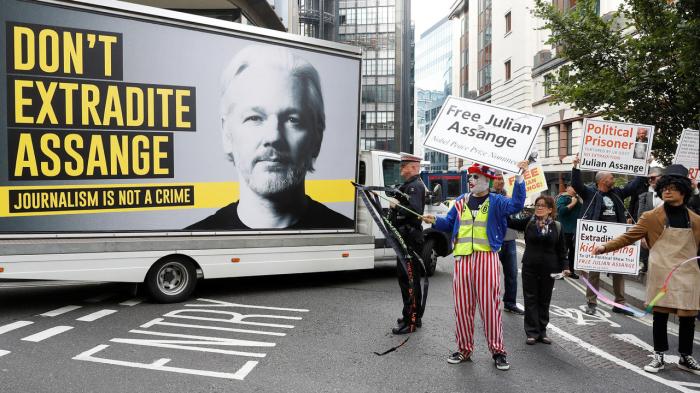 Assange extradition hearing protest wikileaks surrender refuses